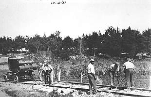 Adjusting railway ties in April, 1931